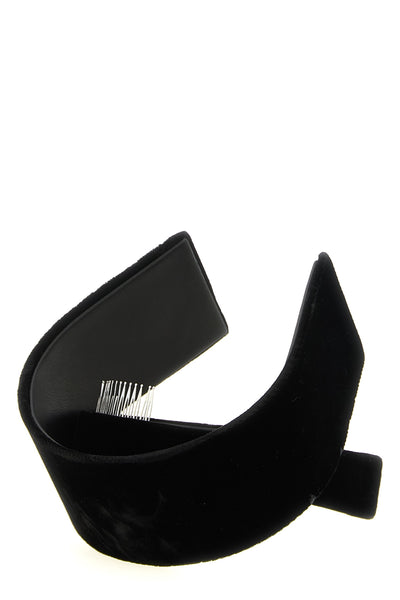 the comme des garcons headband is distinguished by an asymmetrical and sculptura