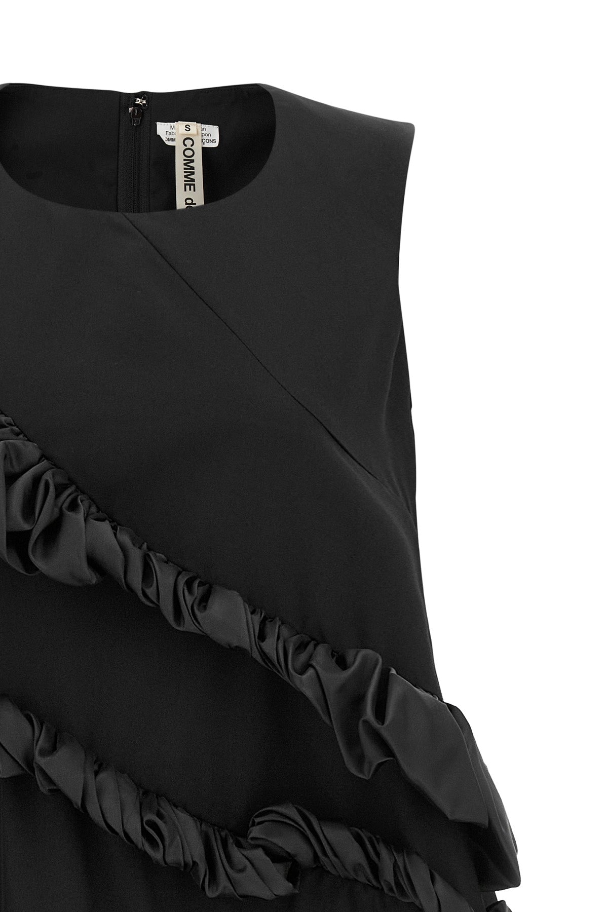 the comme des garçons mini dress redefines volumes through an avant-garde archit