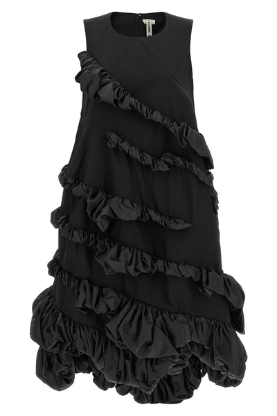 the comme des garçons mini dress redefines volumes through an avant-garde archit