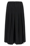comme des garçons trousers redefine sartorial volumes through a sculptural and b