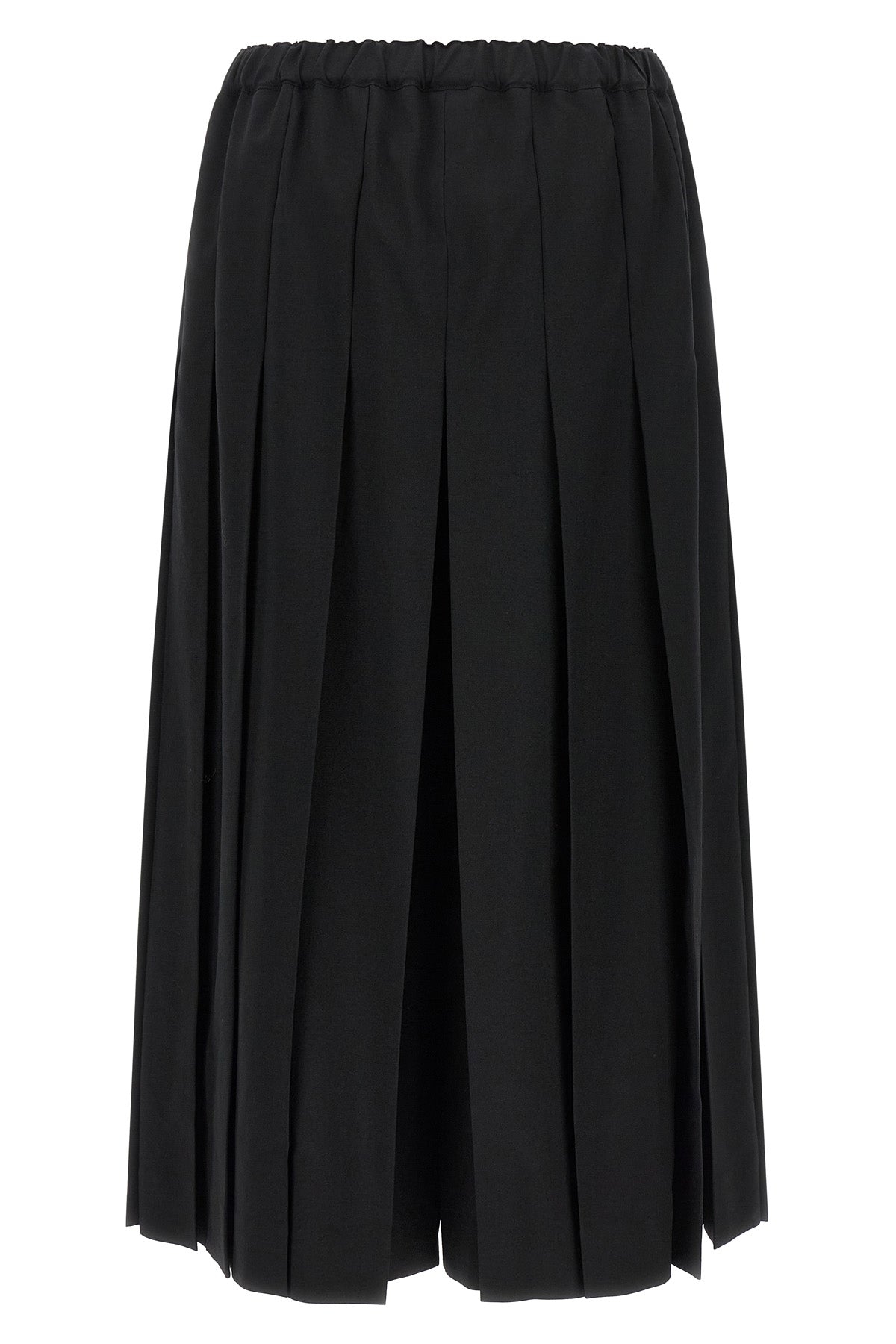 comme des garçons trousers redefine sartorial volumes through a sculptural and b
