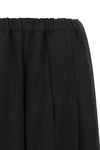 comme des garçons trousers redefine sartorial volumes through a sculptural and b