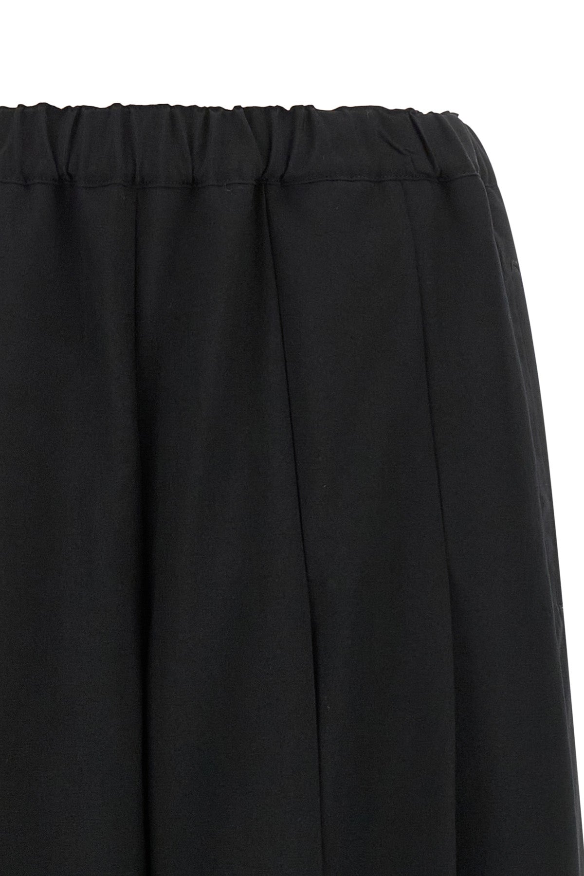 comme des garçons trousers redefine sartorial volumes through a sculptural and b