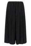 comme des garçons trousers redefine sartorial volumes through a sculptural and b