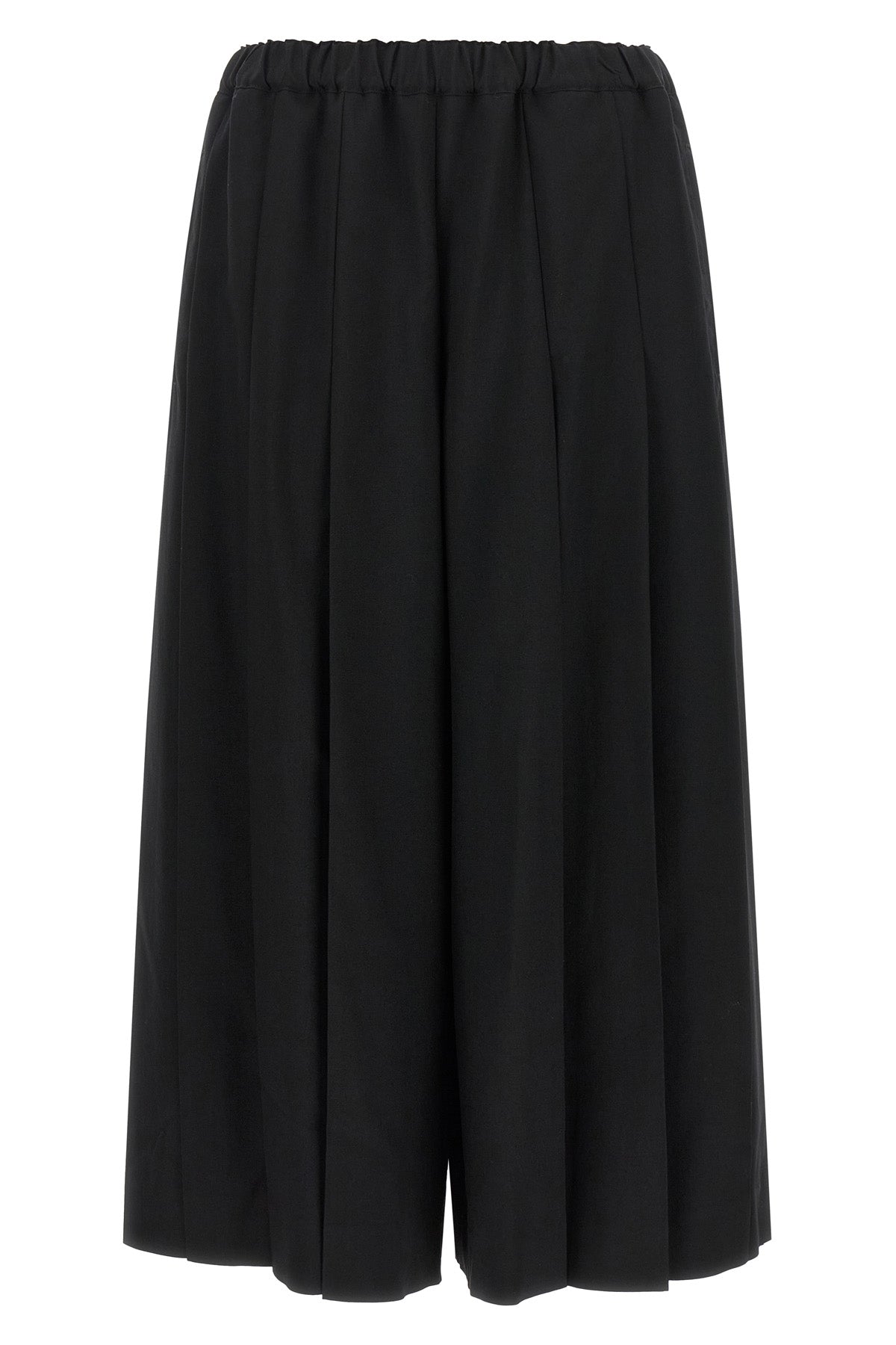 comme des garçons trousers redefine sartorial volumes through a sculptural and b