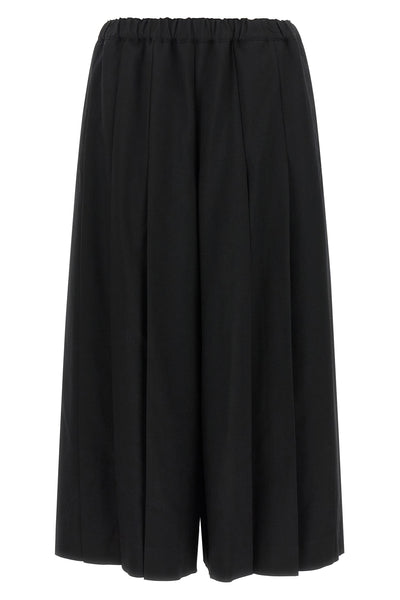 comme des garçons trousers redefine sartorial volumes through a sculptural and b