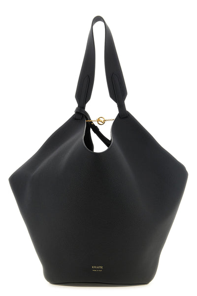the khaite lotus midi tote bag redefines everyday volumes through a deconstruc
