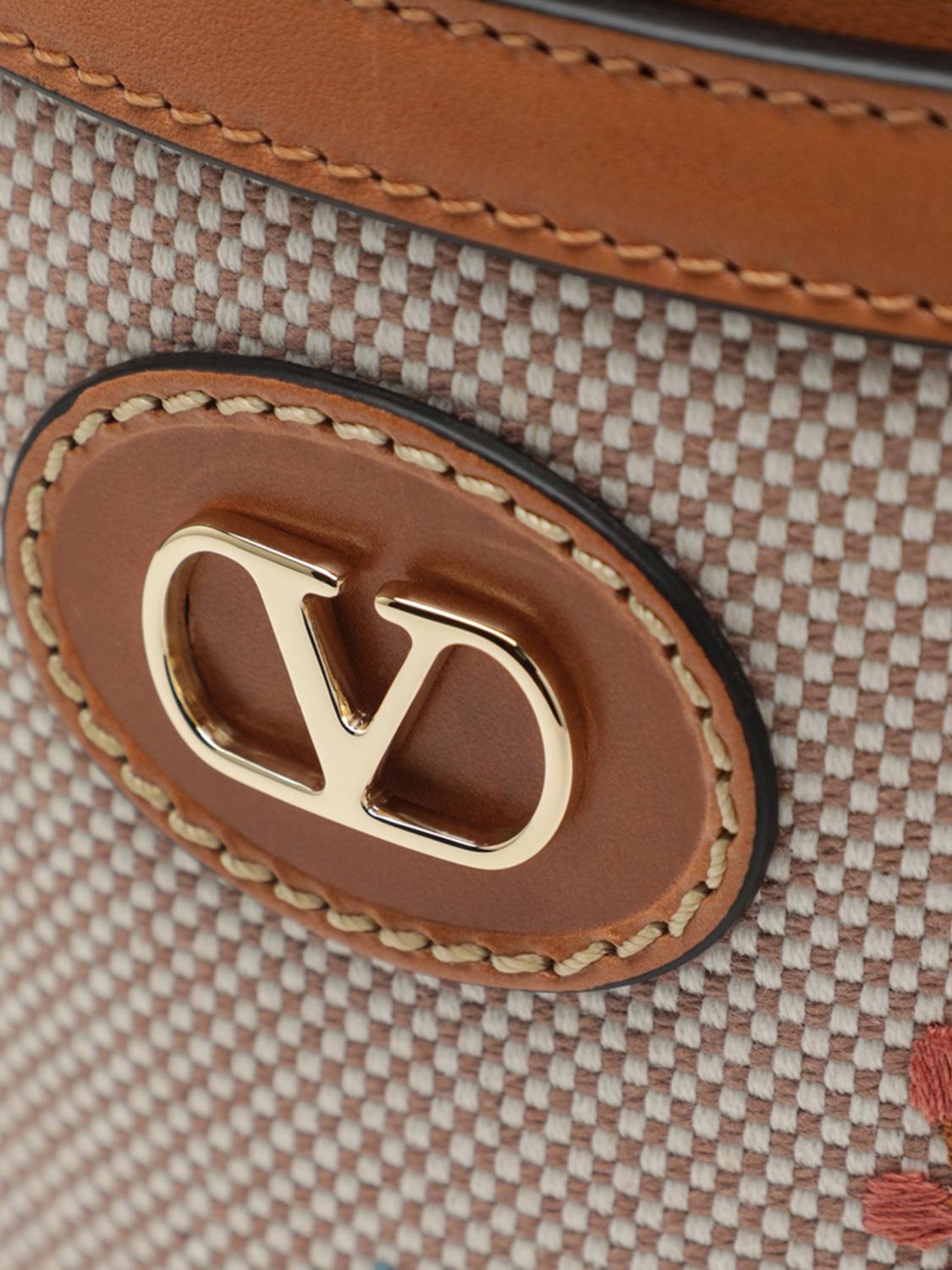 vlogo signature canvas bucket bag with jacquard flowers and leather