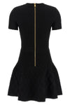 the flared balmain skater dress redefines knitwear codes through an hourglass
