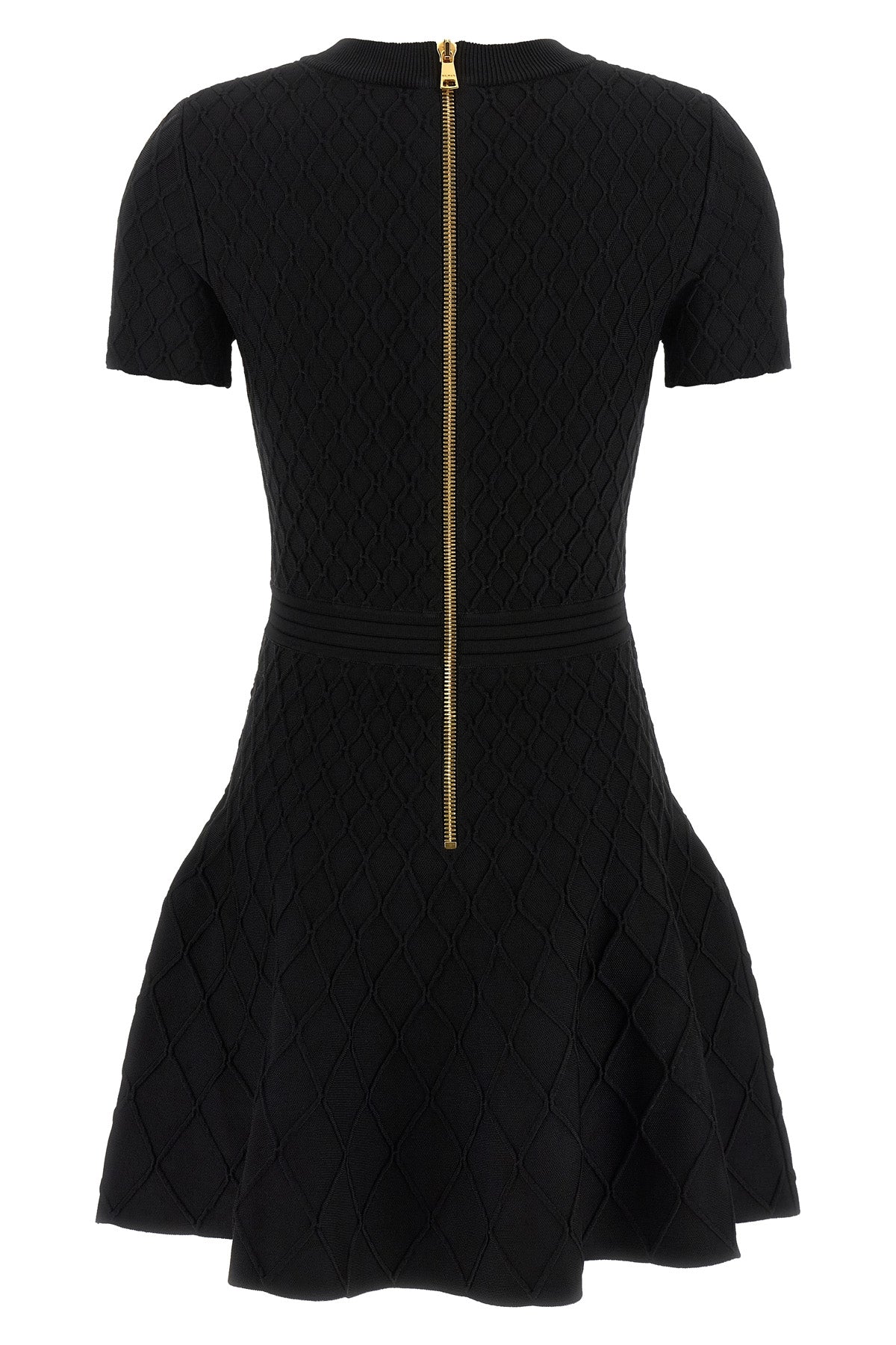 the flared balmain skater dress redefines knitwear codes through an hourglass