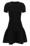 the flared balmain skater dress redefines knitwear codes through an hourglass
