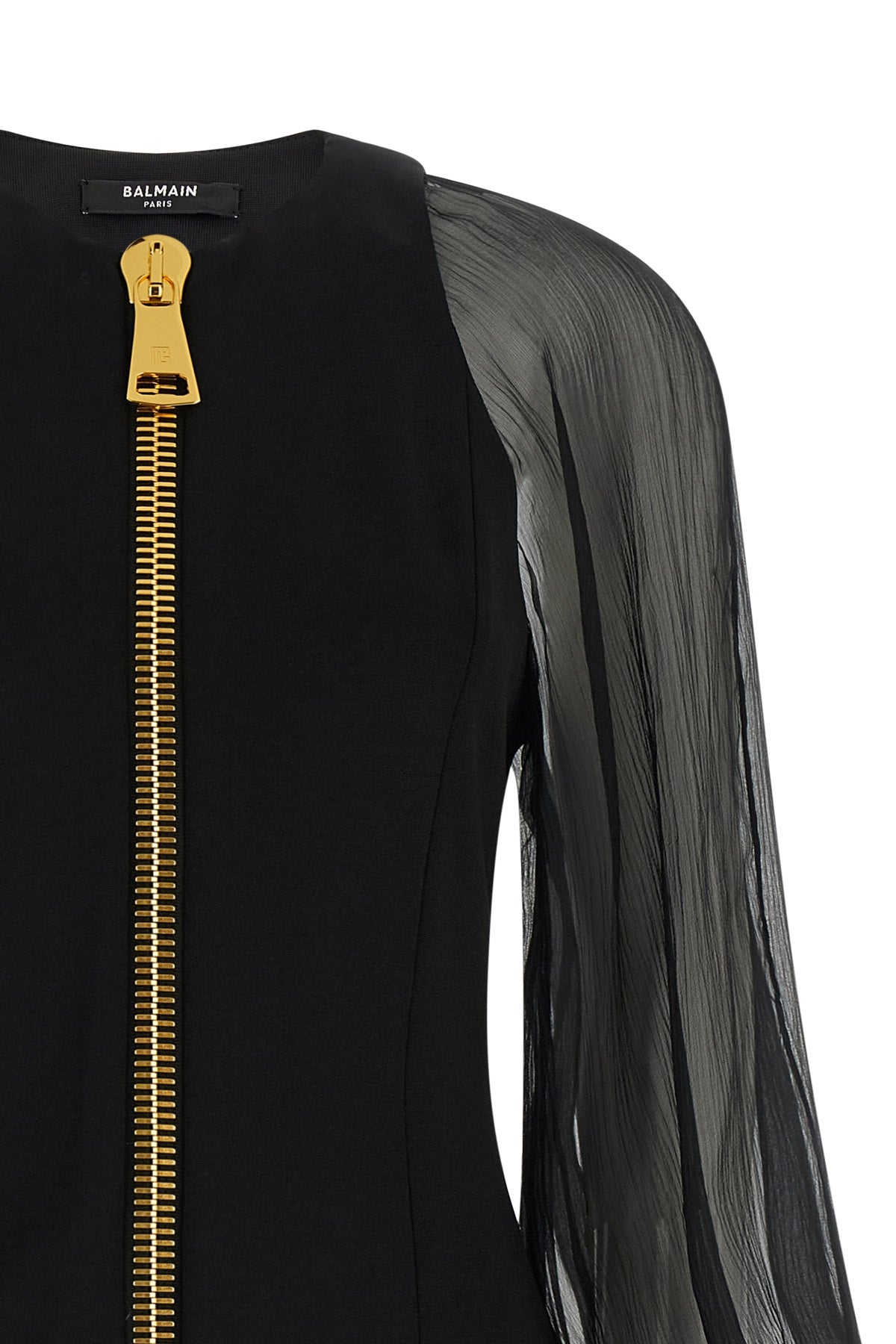 the balmain black mini dress redefines the codes of elegance through a sophistic
