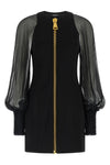 the balmain black mini dress redefines the codes of elegance through a sophistic