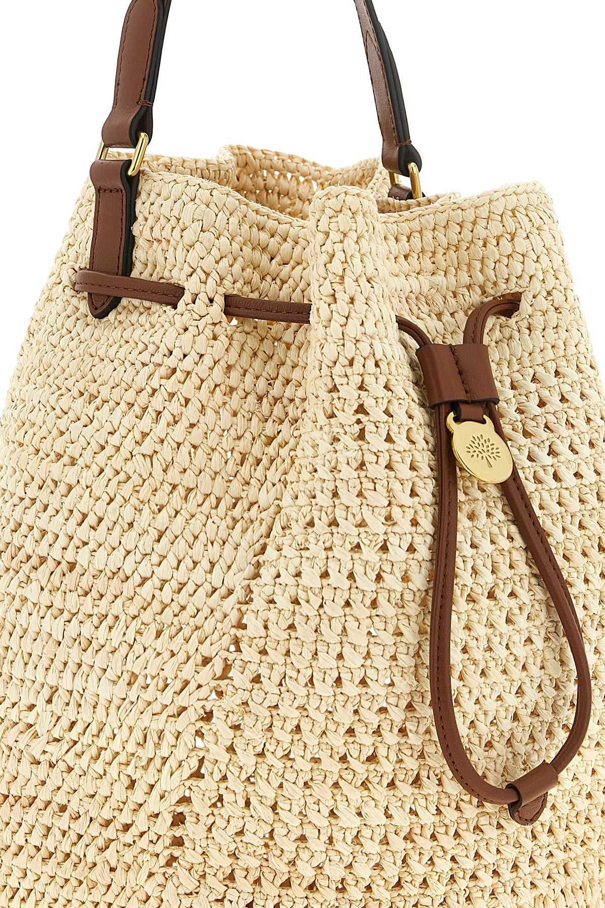 the mulberry bucket bag features a deconstructed silhouette made of crochet wove