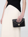 rockstud grained leather clutch