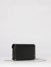 rockstud grained leather clutch