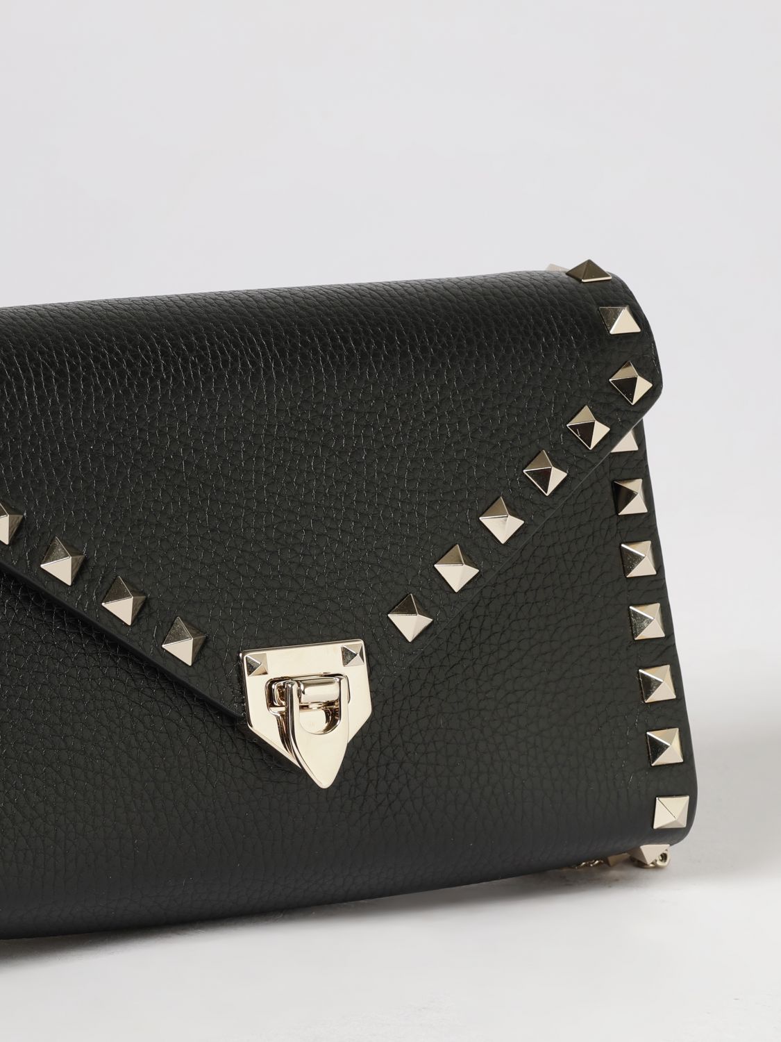 rockstud grained leather clutch