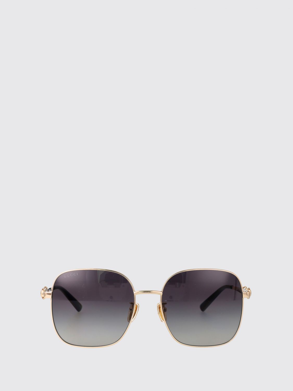 cat-eye metal sunglasses with horsebit detail on the temples