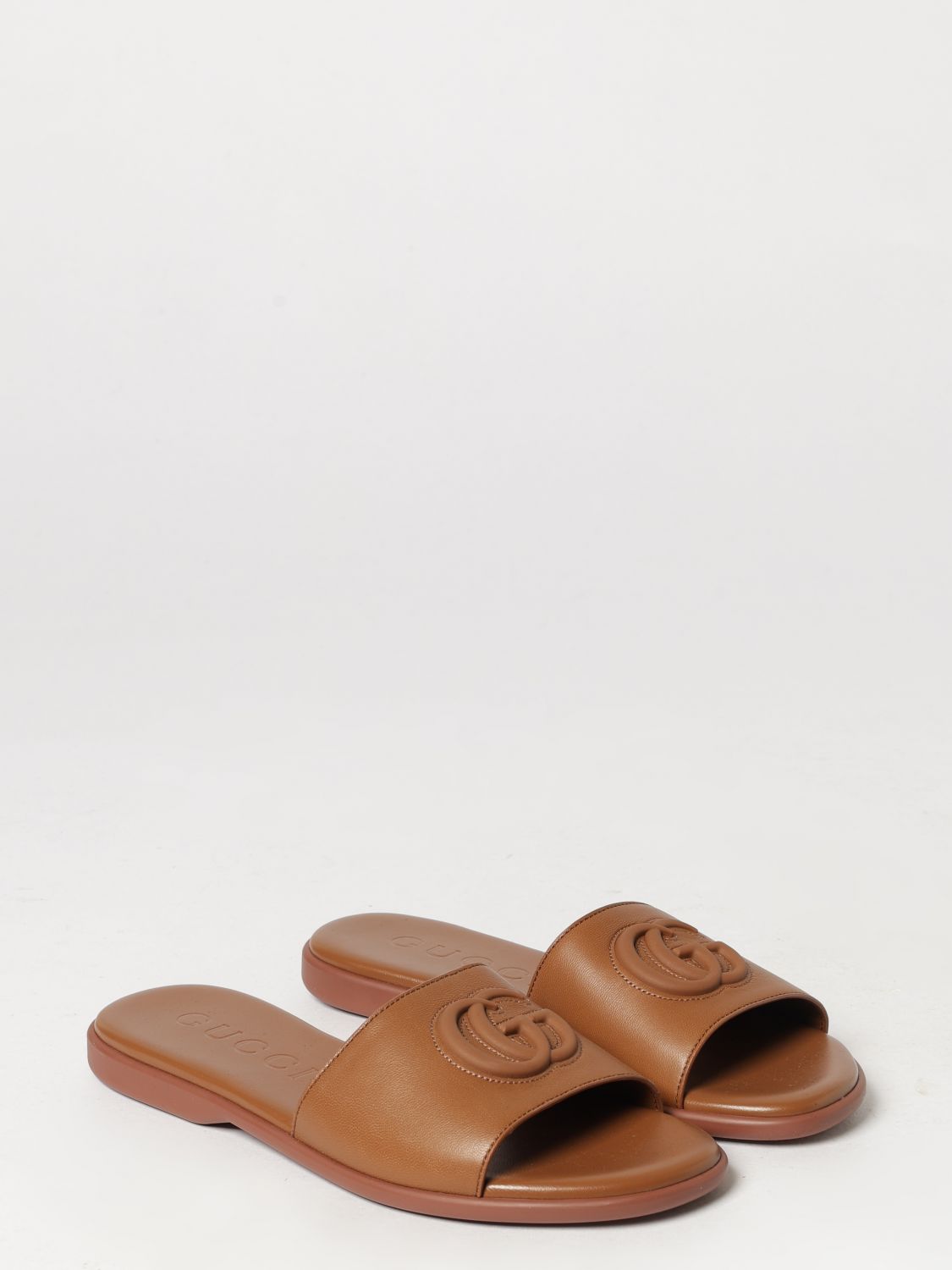 calfskin leather slides with embossed gg monogram