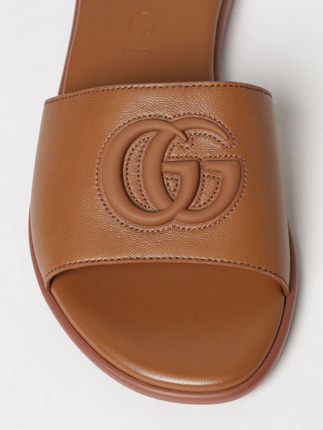 calfskin leather slides with embossed gg monogram