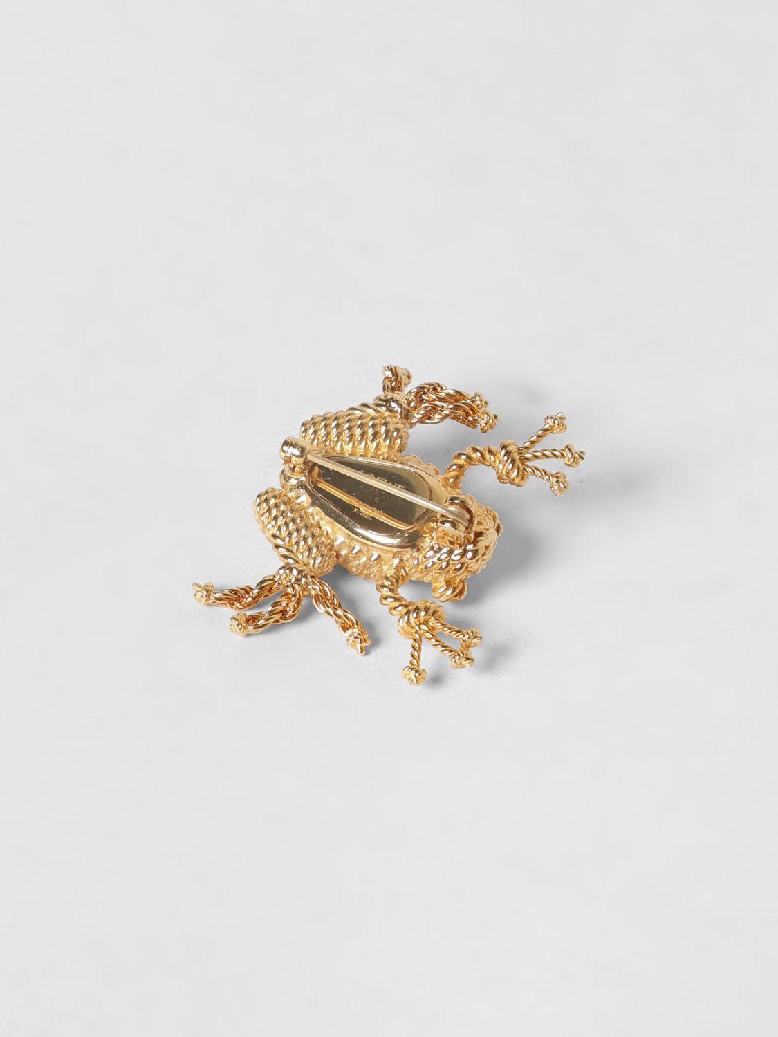 rana gold-coloured brass brooch with engraved logo