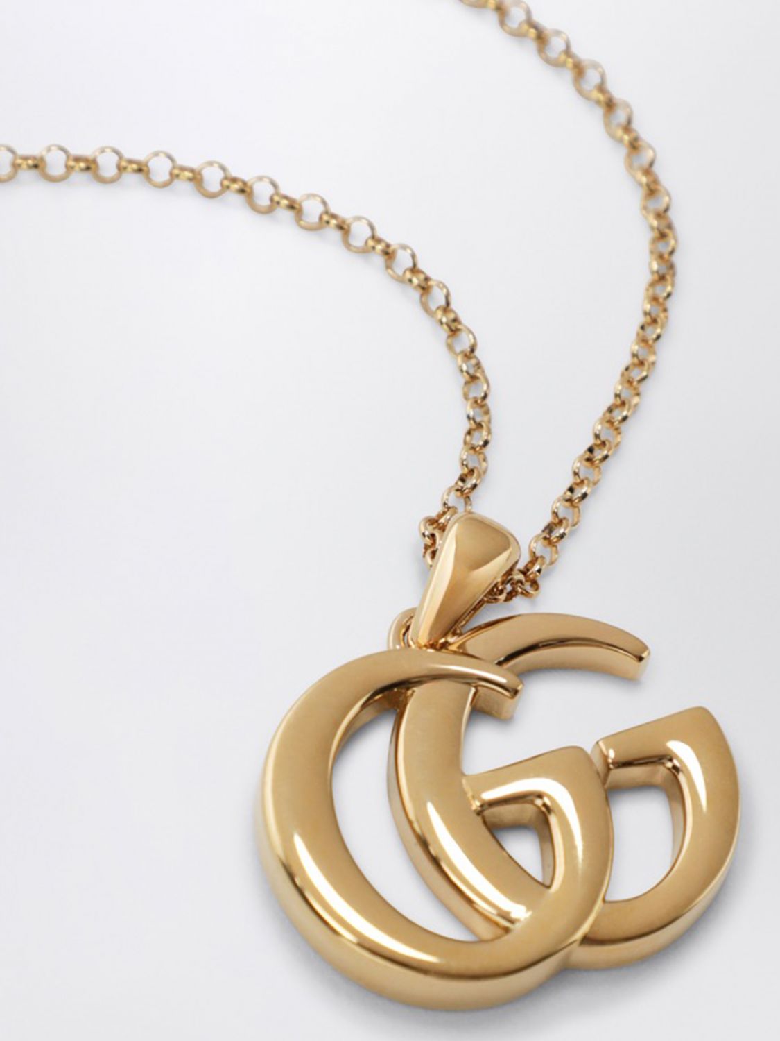 gg marmont gold-finish metal necklace with pendant