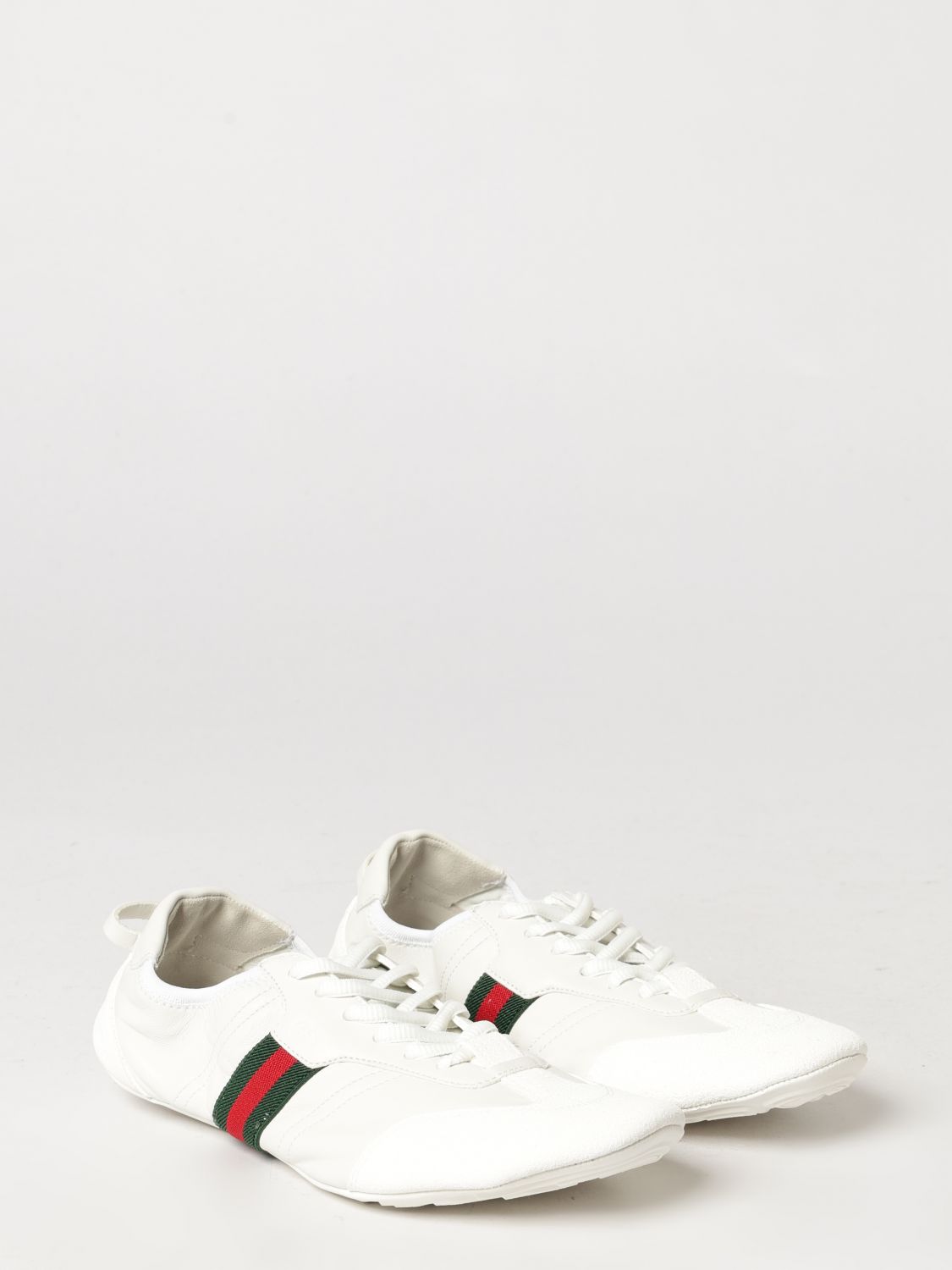flex low-top leather sneakers with iconic web detail