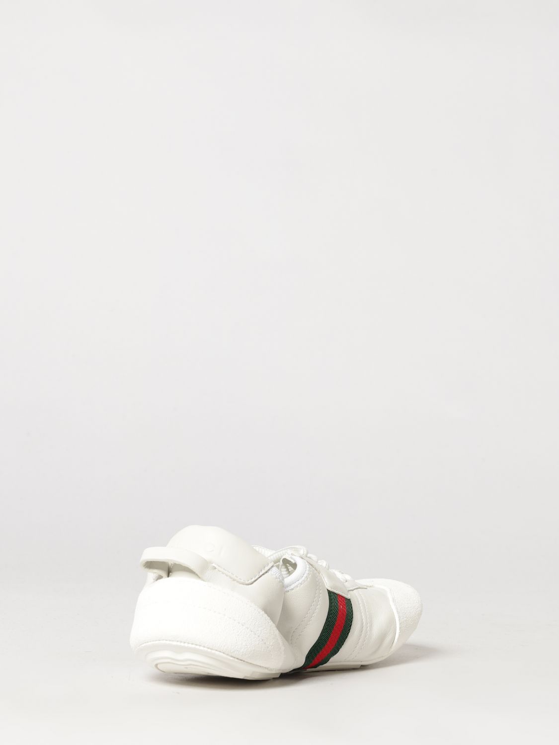 flex low-top leather sneakers with iconic web detail