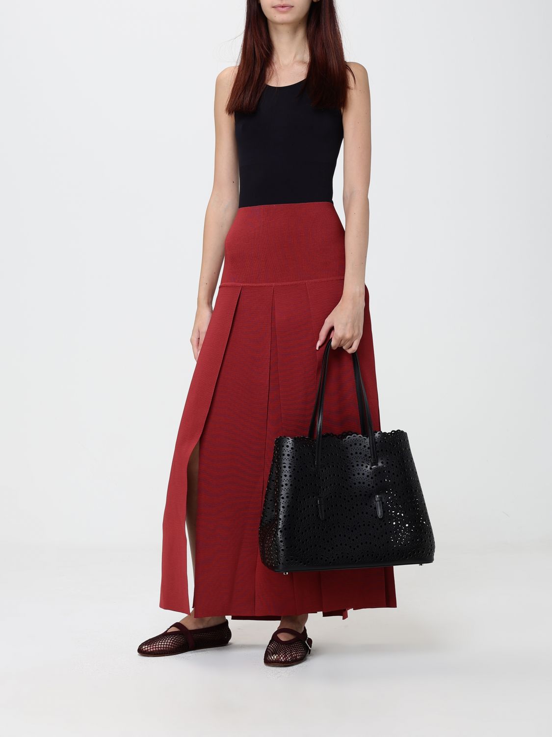 mina shoulder bag in smooth calfskin leather with perforated design and pouch