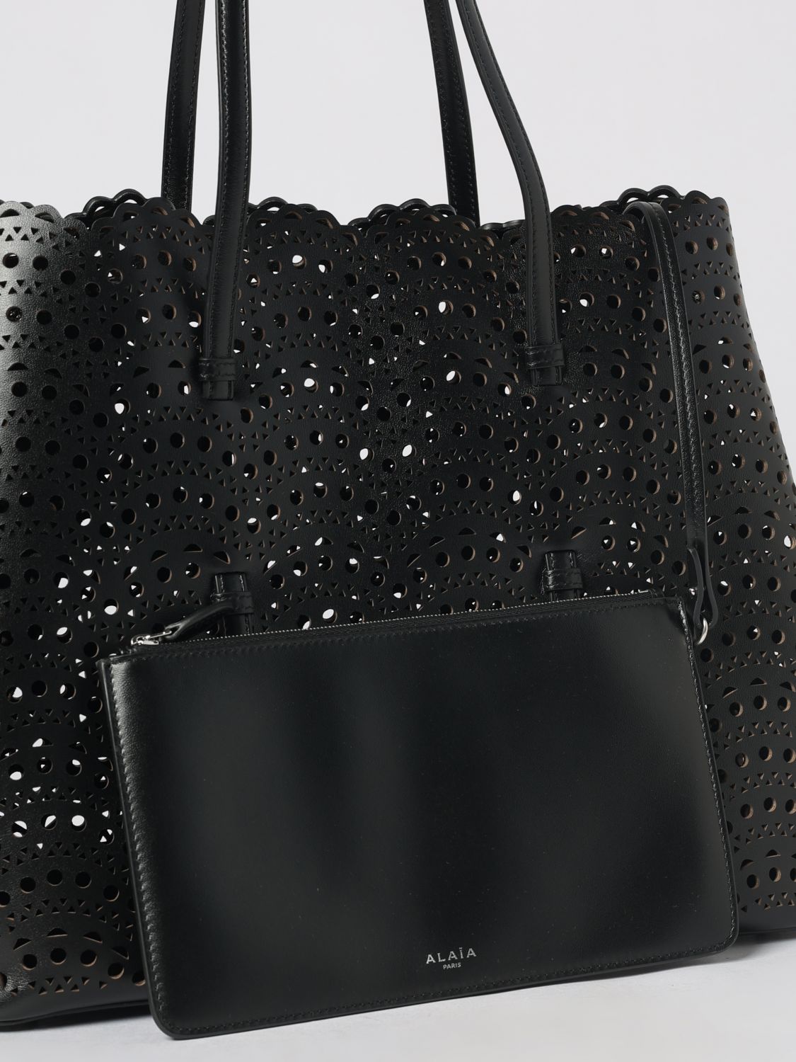 mina shoulder bag in smooth calfskin leather with perforated design and pouch