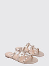 rockstud flat sandals in laminated leather with studs