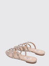 rockstud flat sandals in laminated leather with studs
