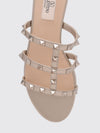 rockstud flat sandals in laminated leather with studs