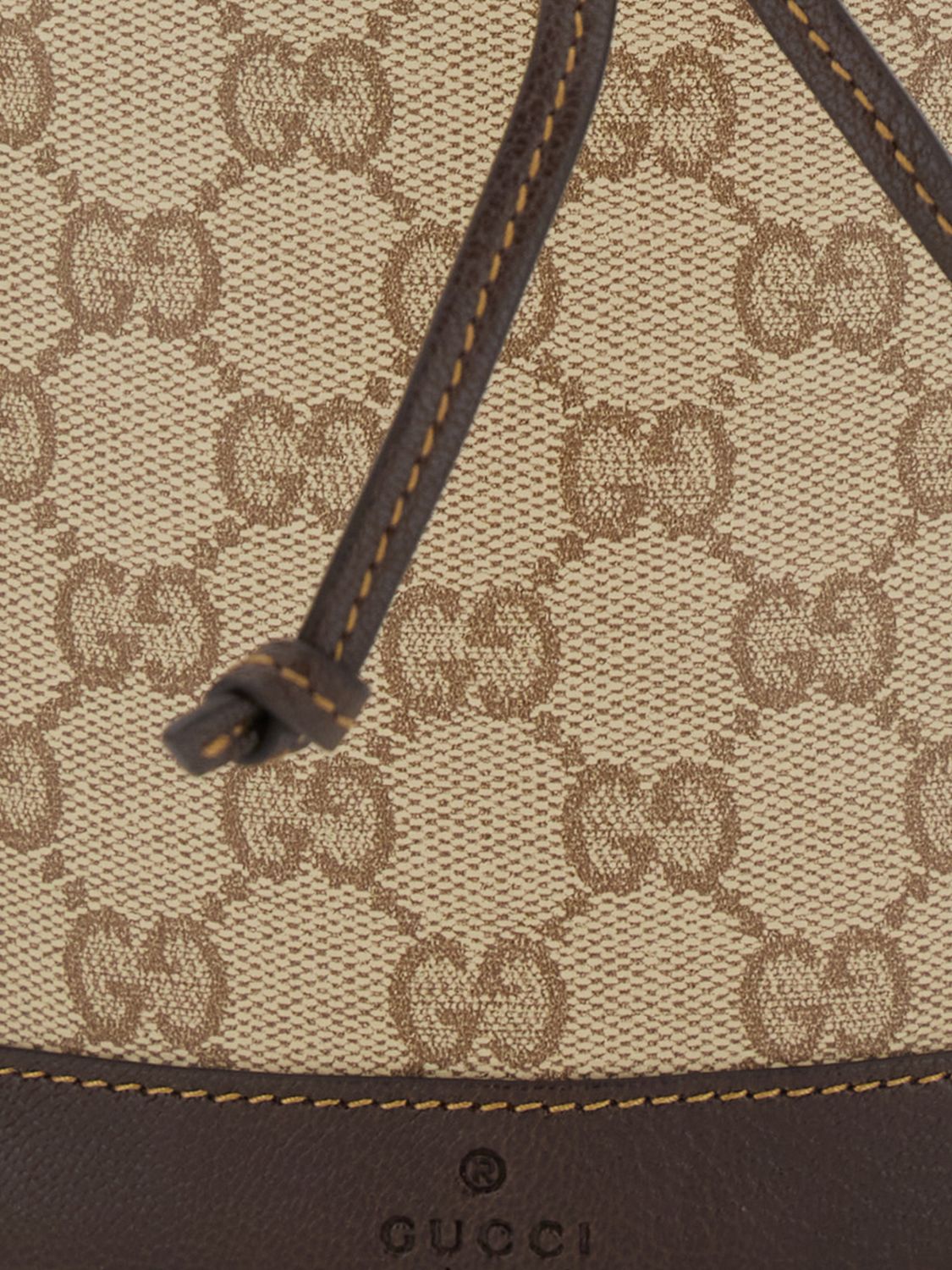 mini bucket bag in gg monogram fabric with drawstring closure