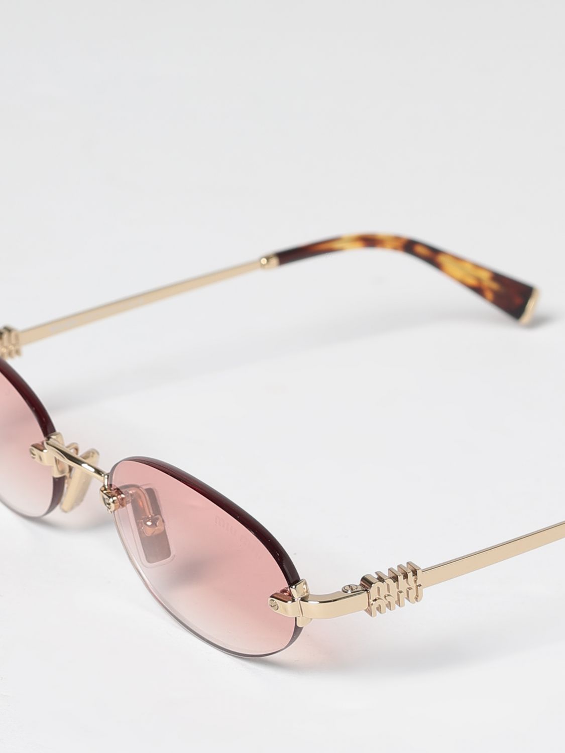 oval metal sunglasses with bridge and tortoiseshell temples