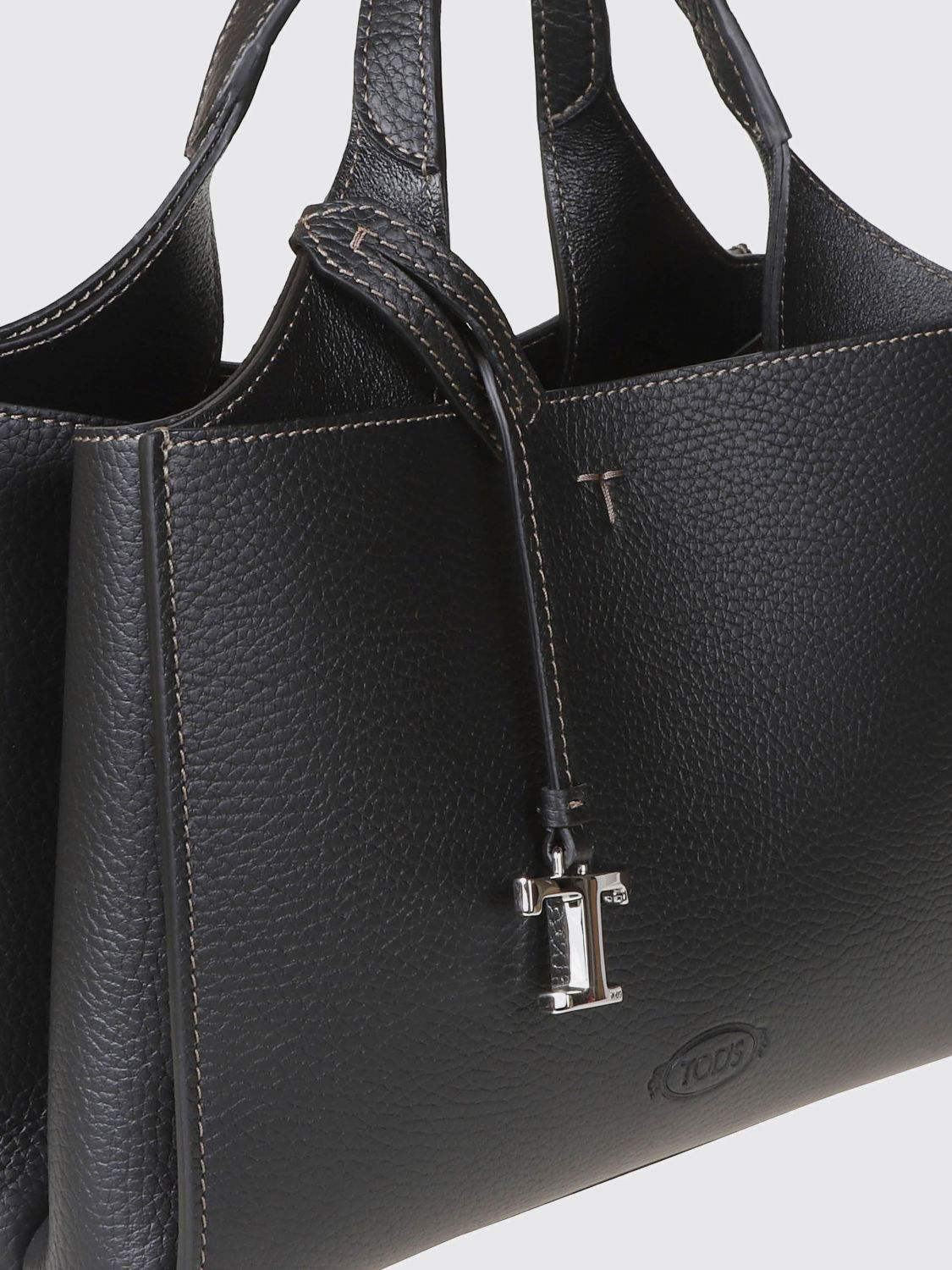 handbag in tumbled leather with double handle and logo charm