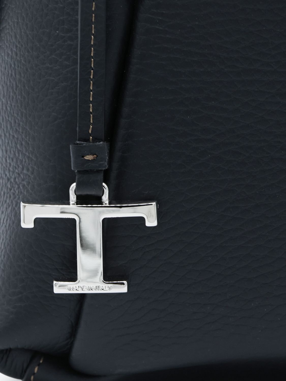 grained leather handbag with zip closure and logo charm