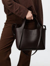 faux leather handbag with perforated logo and strap