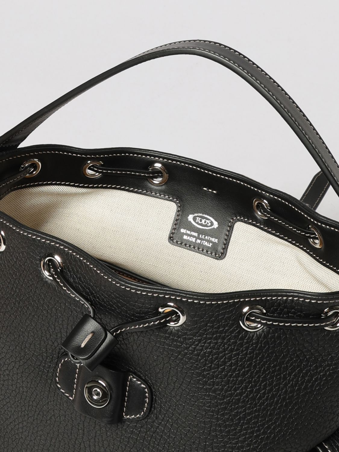 backpack in black hammered leather with drawstring and t timeless logo