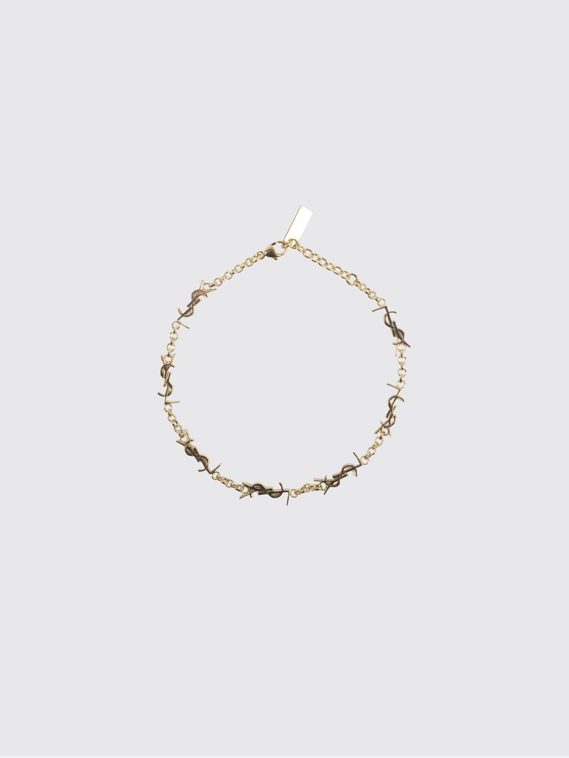 gold-tone metal bracelet with interlaced ysl monogram pendant