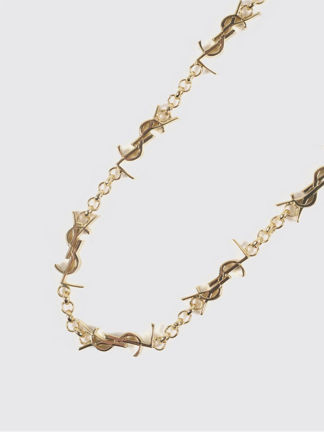 SAINT LAURENT M gold-tone metal bracelet with interlaced ysl monogram pendant