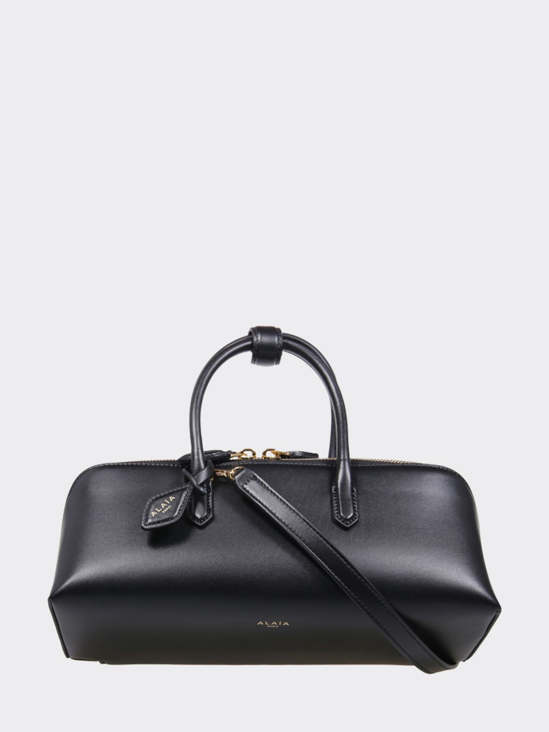 small leather handbag with double tubular handle and logo charm