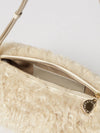 cylindrical shearling shoulder bag with adjustable handle