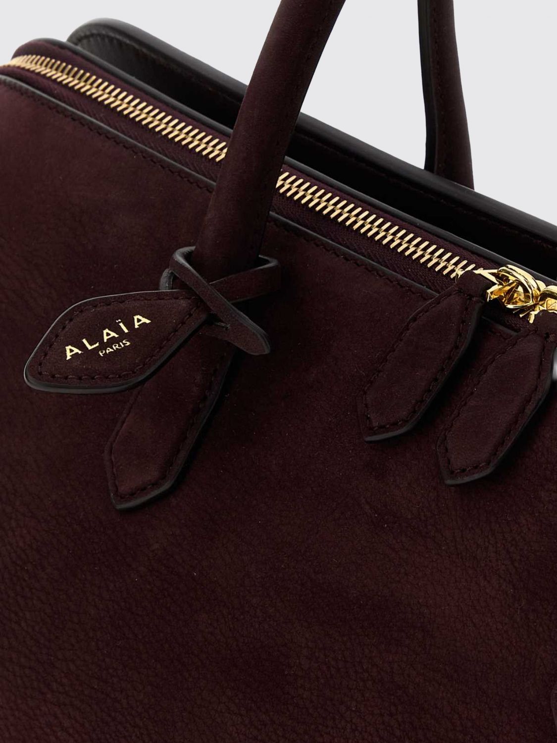 delta medium nubuck leather handbag with double zip and shoulder strap