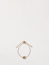 anagram brass bracelet with drawstring closure