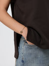 anagram brass bracelet with drawstring closure