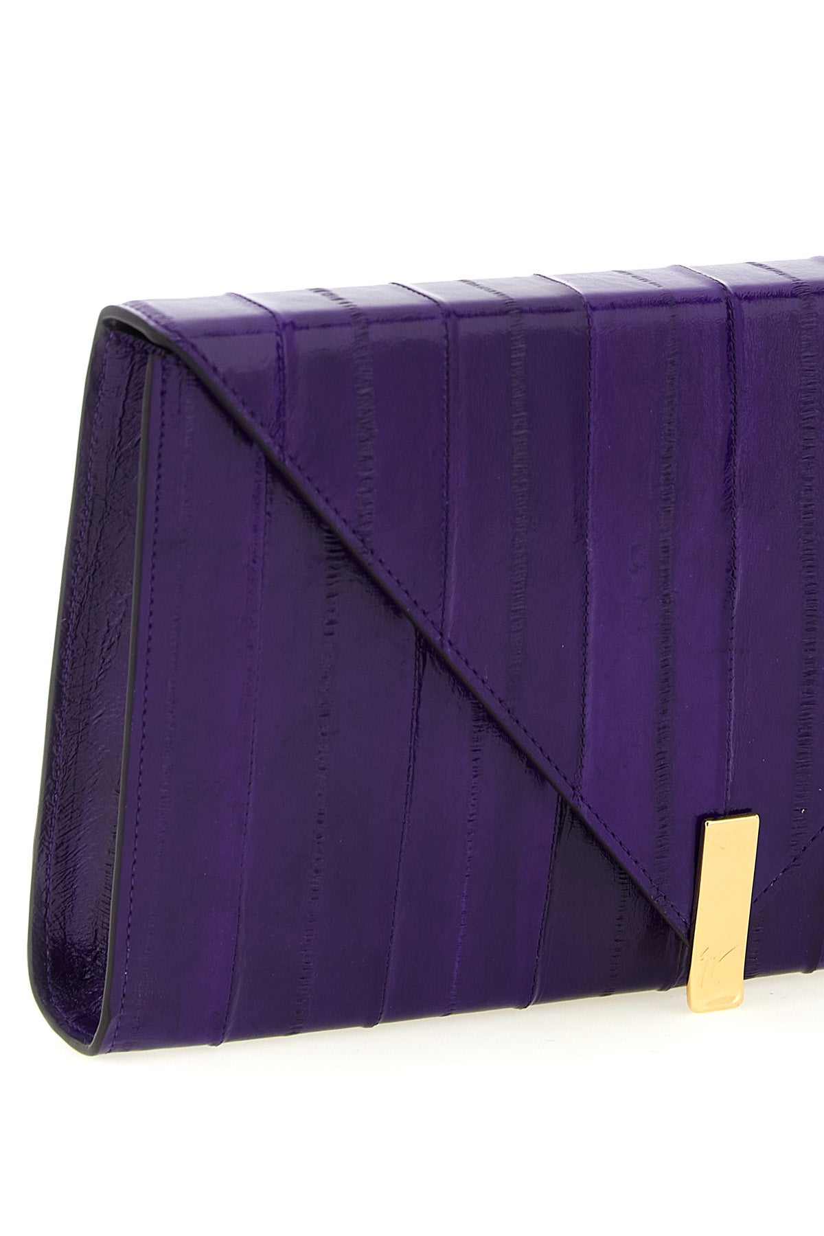 the giuseppe zanotti tuxedo clutch defines a rigorous aesthetic through clear