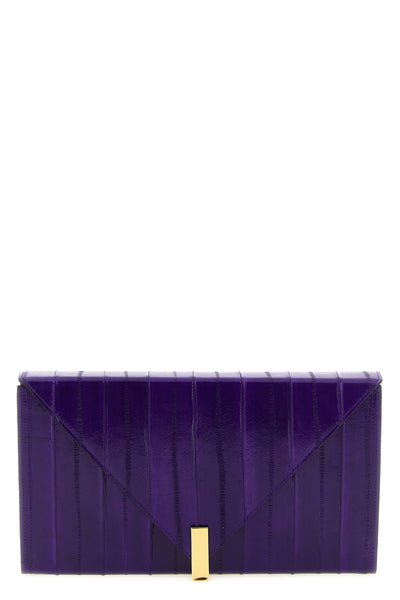 the giuseppe zanotti tuxedo clutch defines a rigorous aesthetic through clear