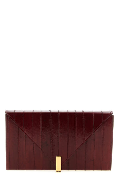 the giuseppe zanotti tuxedo clutch defines evening elegance through a structur