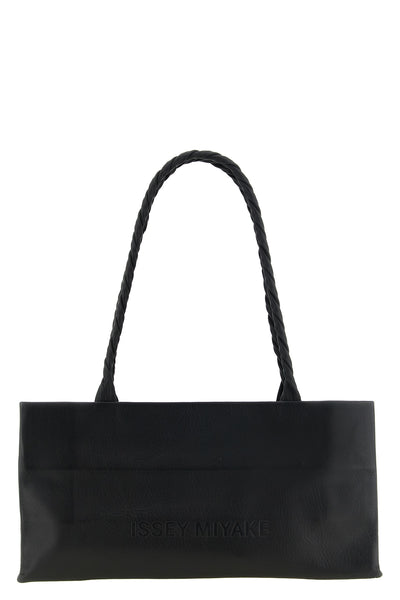 the issey miyake paper bag shoulder bag redefines everyday volumes through a m